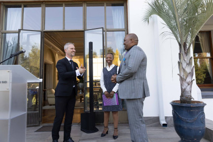 Professor Bismark Tyobeka, accompanied by his wife Ngeniswa, receives the National Order of Merit from French Ambassador David Martinon - Photo: NWU